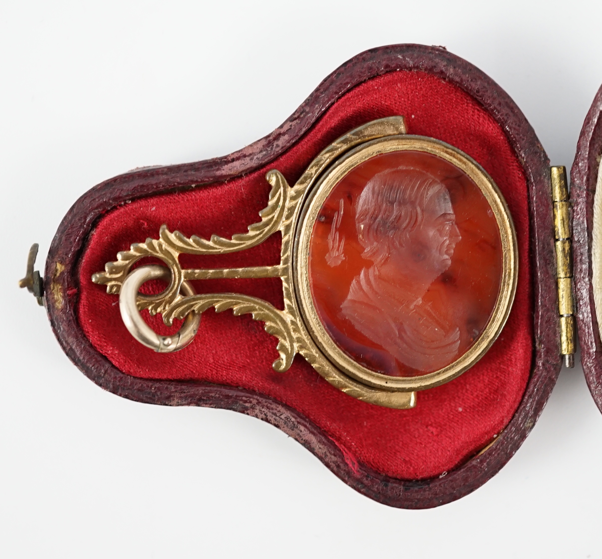 A late 18th/early 19th gilt metal mounted intaglio agate set swivelling fob seal, carved with the bust of Edmond Halley with the comet, 47mm, in original box.